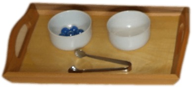 TRANSFERING MARBELS USING TONGS(FEW MARBALES,TWO WOODEN BOWLS,A WOODEN TRAY TRAY WITH PAIR OF TONGS)