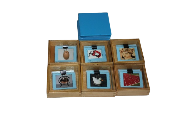 BLUE PICTURE BOXES 1-6((WOODEN BOX CONTAINING PICTURE CARDS WITH VOWELS SOUNDS A,E,I,O,U AND ONE MIXED VOWEL WITH CORRESPONDING NAME TAGS)